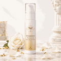 Siero viso Elixir Serum Age Le Perle Renaissange, flacone bianco e oro con erogatore spray e tappo trasparente.